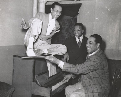 Duke Ellington (right), Alfredo Gustar (left), and Billy Strayhorn (center) inside the Stanley Theatre in Pittsburgh, Pennsylvania, ca. 1943-43