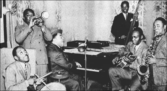 Fats Waller and his Rhythm – 1938 left to right Slick Jones, Herman Autrey, Fats Waller, Cedric Wallace, Albert Casey, Eugene Sedric